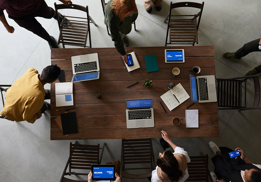 People approach a table to sit around it